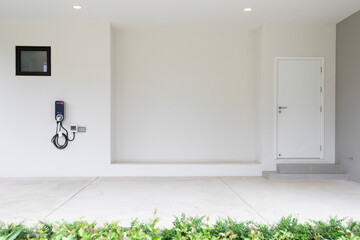 Bangkok, Thailand - December 9, 2022.Electric Car Charging with EV charger at modern home.