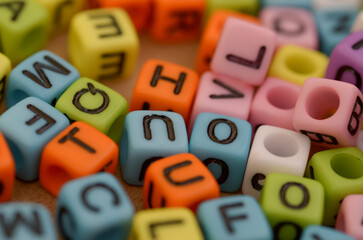 The beads can be used as a tool for learning the alphabet, spelling, and reading, symbolizing the foundation of education.
