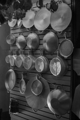 Some pots hanging on the supermarket wall
