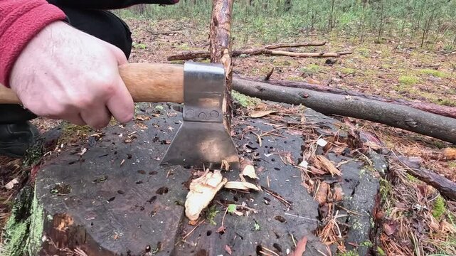 sharpen a stake with an axe