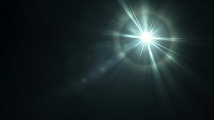 Obraz premium A single lens flare in the center of an all black background