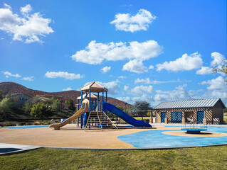 Fototapeta premium Outdoor playground equipment with slides at a public park