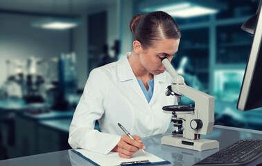 Medical Research Scientist Use Microscope To Analyze Sample.