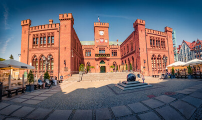 Fototapeta premium Colorful summer view of Old Town Hall in Kolobrzeg city, Poland, Europe. Wonderful afternoon cityscape of Kolobrzeg, Polish city on the Baltic Sea. Traveling concept background..