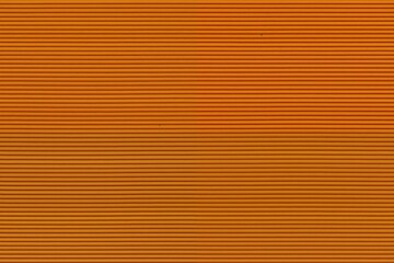 Obraz premium Textured background featuring horizontal lines in various shades of orange, creating a warm and vibrant appearance.