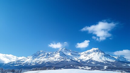 Fototapeta premium Majestic Snowy Mountain Peaks Under a Clear Blue Sky, Evoking a Sense of Grandeur