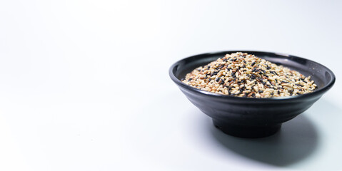 rice in black bowl in white background