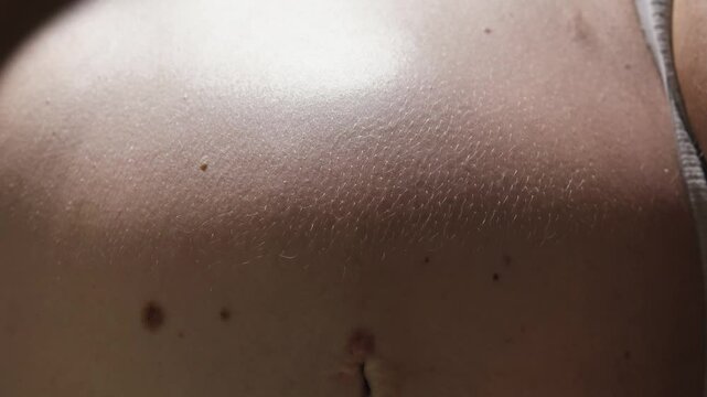 Close-up of the movement of the surface of the pregnant abdomen. Active movement of the baby inside the mother's abdomen. The baby is kicking and moving