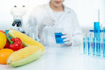Scientist check chemical food residues in laboratory. Control experts inspect quality of vegetables...