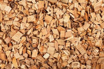Pile of mixed wood chips as background, top view. Wooden chips for smoking meat and fish.