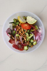 Sorted kitchen waste in a bowl on kitchen counter top, vegetable and fruit peels sorted  for recycling, Sustainable life style concept.