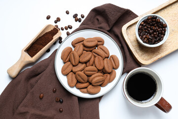 A cup of coffee with cookies on a white background