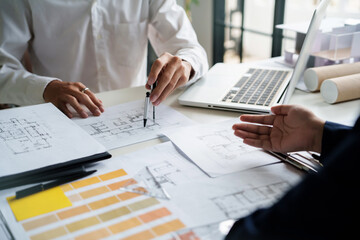 Engineer or interior Architects designer construction plans on blueprint