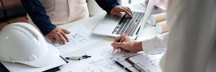 Engineer or interior Architects designer construction plans on blueprint