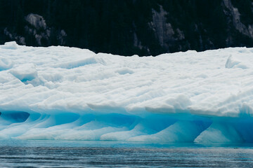Iceberg from Sawyer glacier floating in Tracy Arm fjjord in Alaska near Juneau