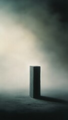 A solitary, abstract object stands in a misty environment, creating a mysterious and dramatic atmosphere.