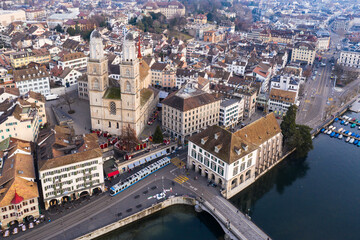 Zurich, Switzerland: Aerial drone view Zurich old town city center along the Limmat river with the Grossmunster cathedral in Switzerland largest city.