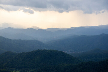Fototapeta premium Landscape of Morning Mist with Mountain Layer at north of Thailand. mountain ridge and clouds in rural jungle bush forest
