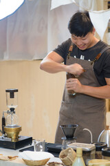 barista is preparing equipment for making coffee.