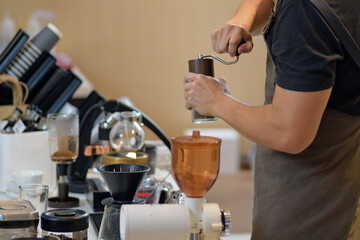 barista is preparing equipment for making coffee.