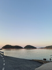 
It is a sea with a coastal road.