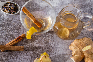 top view of jar of fresh ginger tea with lemon and cinnamon