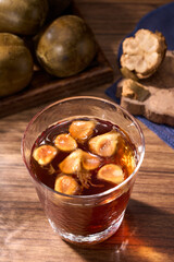 A cup of brewed monk fruit drink, a traditional Chinese medicine
