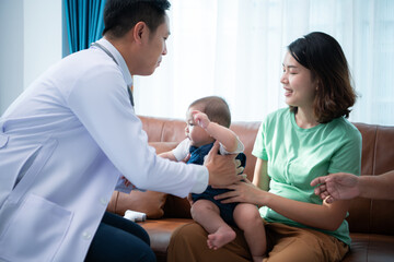 A little child and his family visit the doctor for a routine health checkup