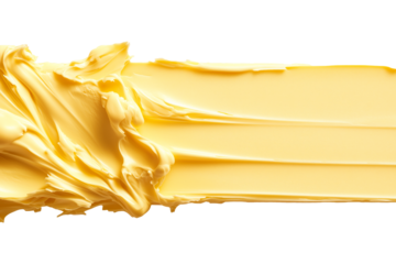 A dollop of creamy butter displays its smooth, rich texture, perfect for spreading on bread or cooking isolated on white