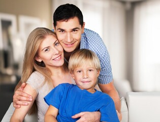 Obraz premium Loving family sitting on couch in room