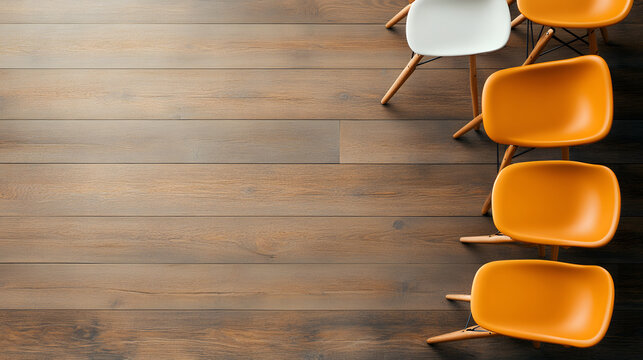 Chairs arranged in a circle with one conspicuously empty