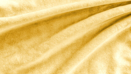 Gold velvet background or golden yellow suede velour flannel texture made of cotton or wool with...