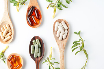 Vitamin capsules in a wooden spoon, soft gels, Fish oil capsules, omega 3, omega 9, vitamin D,...