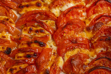 Baked tomatoes with mozzarella cheese.