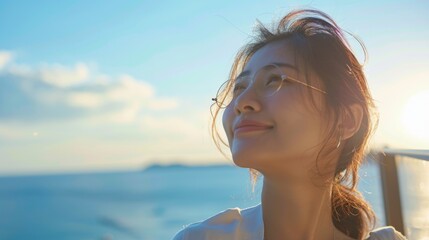 Naklejka premium Young Woman Enjoying Sunset by the Ocean