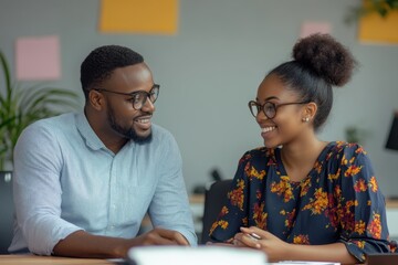 Naklejka premium Supportive African American Business Consultant Mentoring Young Entrepreneur in Office Setting