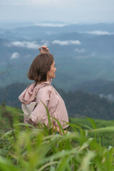 Traveler sightseeing the beautiful scenery of nature and mist during time the sunrise