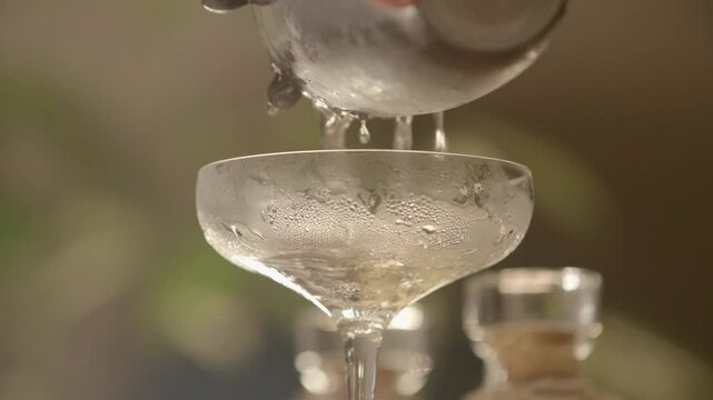 Close up Pouring Alcohol into Glass