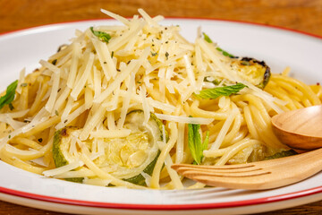 Spaghetti with grilled zucchini and parmesan cheese.