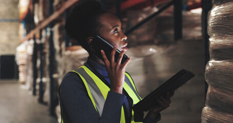 Warehouse, black woman and tablet with phone call for distribution, coordinate shipment or confirm delivery. Supply chain, supervisor or inspection with tech for inventory check, track stock or night © LuxeShutter24/peopleimages.com