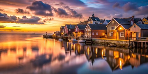 Fototapeta premium Charming fishing village at dusk, warm golden light on rustic buildings, soft pink hues in the cloudy January sky, calm ocean reflecting the serenity.