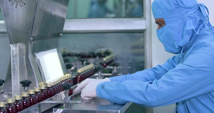 medicine liquid filling in bottles, manufacturing chemical liquid sanitiser gel fills in bottles aqueous soap hand wash detergent medicine production line filling making process in a plastic bottle
