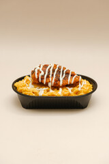 Mac and cheese tasty Italian pasta with Cheddar cheese on plain background