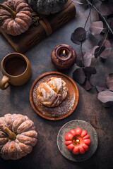 Hot tea with sweet choux pastry for autumn breakfast. Cozy autumn still life, hygge
