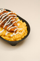 Mac and cheese tasty Italian pasta with Cheddar cheese on plain background