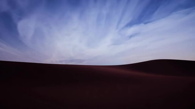 Deep resonating sounds echo through the desert at twilight, creating an immersive experience