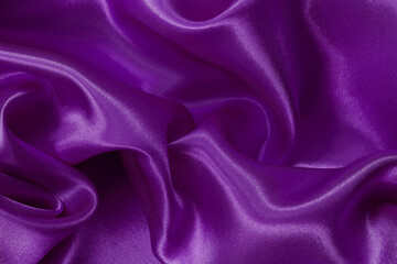 Dark purple fabric texture background, detail of silk or linen pattern.