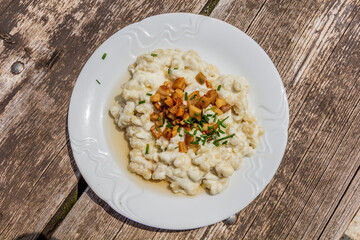 National dish of Slovakia - Bryndzove halusky (potato dough lumps with a sheep cheese and bacon)