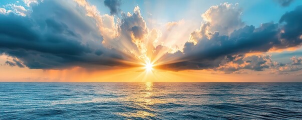 Sun rays breaking through dark storm clouds over the ocean, dramatic weather, hope after the storm