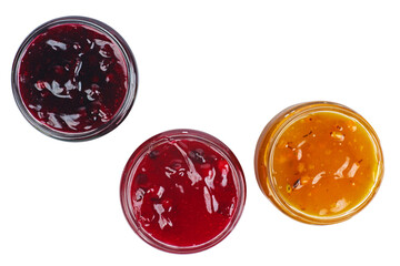 Three colored jam in glass jare isolated on a white background.Top view